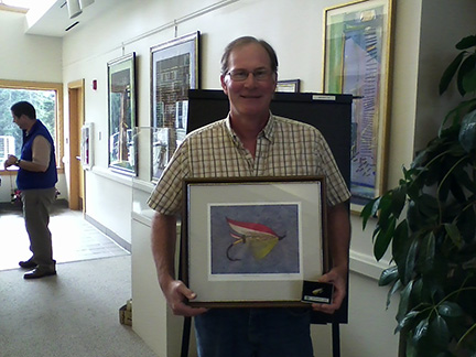  Joe Norton of Trout Unlimited won this nice fly and print during the Silent Auction. It was donated by J.D. Irving, Ltd.