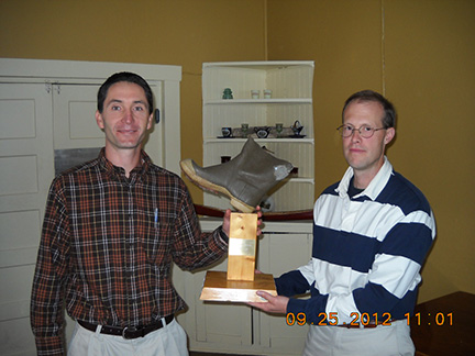 John Magee presents the Soggy Boot Award to Jud Kratzer for the most humorous presentation.