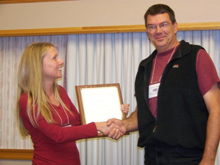 Alison Johnson (incoming President, 2008) presents Steve Shepard (outgoing President, 2007) with a plaque on behalf of the AIC members for a job well done!