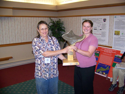 Lisa Bowron accepting the coveted "Soggy Boot" award for funniest fish picture. Incidentally, a photo of Lisa kissing her fish of choice, the White Sucker.
