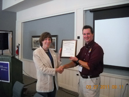 Past President, Scott Craig, passes the torch to Christine Lipsky, our new Past President.