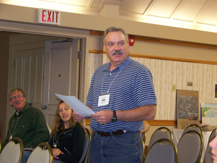 Norm Dube in his last official reading of the Archives Committee report (Committee of 1).